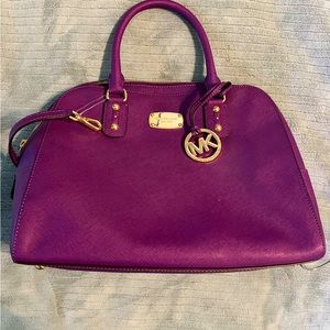 Purple Michael kors bag.
